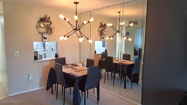 carpeted dining space with a chandelier