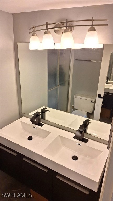 bathroom with toilet and vanity