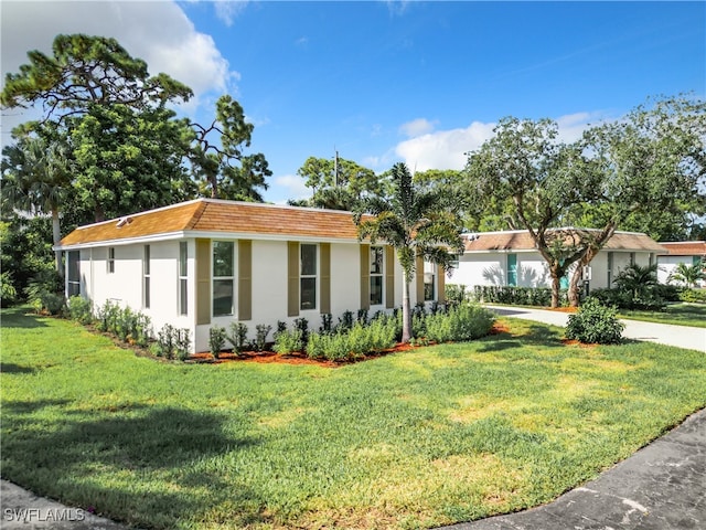 view of front of home with a front lawn