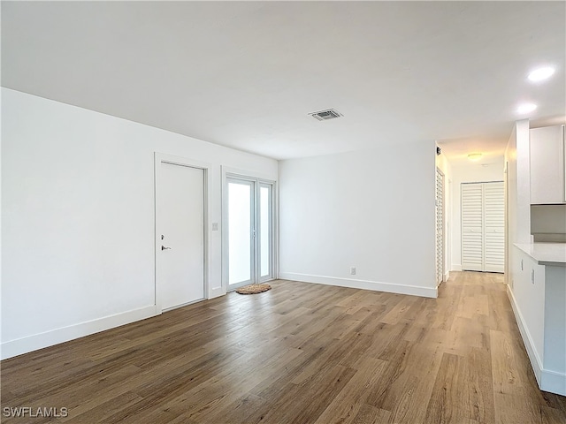 unfurnished living room with light wood-type flooring