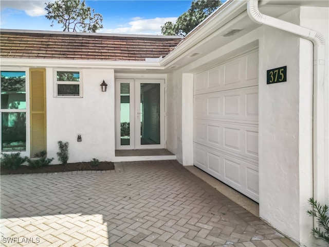 doorway to property featuring a garage