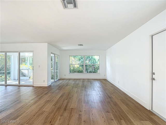 empty room featuring hardwood / wood-style flooring