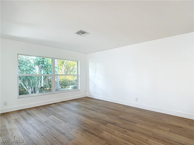 empty room with wood-type flooring