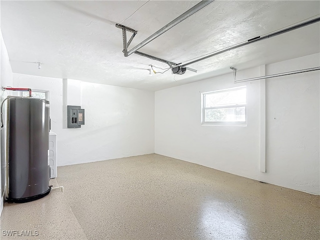 garage with water heater, electric panel, and a garage door opener