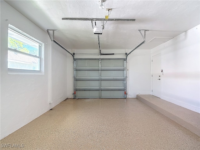 garage featuring a garage door opener