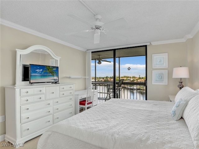 bedroom featuring a wall of windows, a textured ceiling, ceiling fan, access to outside, and ornamental molding