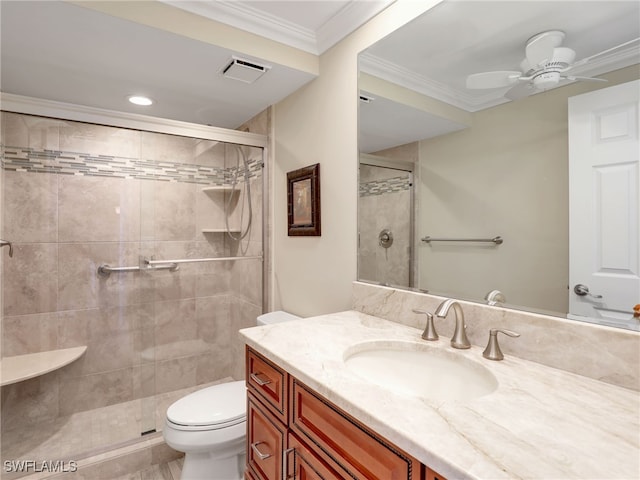 bathroom featuring vanity, walk in shower, ceiling fan, ornamental molding, and toilet