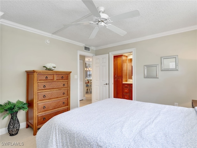 carpeted bedroom featuring a textured ceiling, crown molding, ensuite bath, and ceiling fan