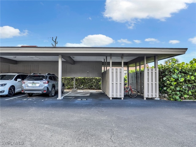 view of parking / parking lot with a carport