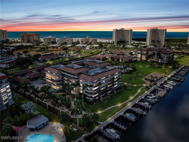 aerial view at dusk with a water view