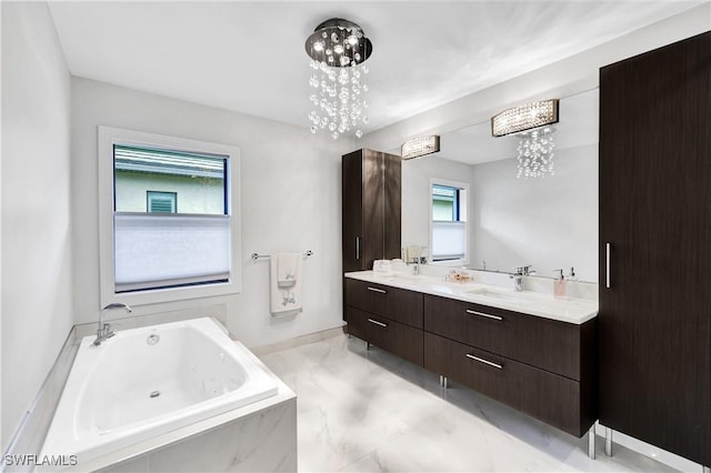 full bath featuring double vanity, plenty of natural light, a sink, and a whirlpool tub