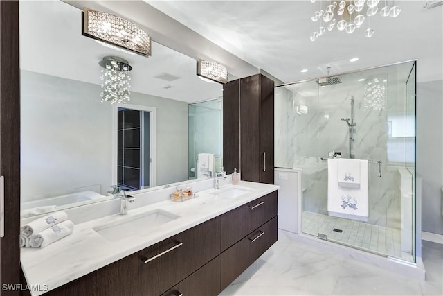 full bathroom with marble finish floor, a marble finish shower, visible vents, and a sink