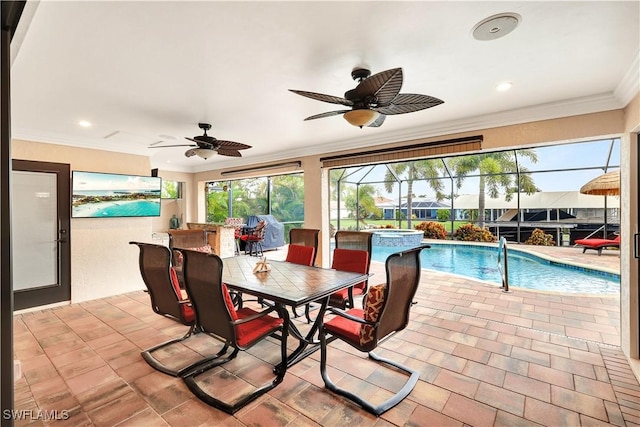 view of swimming pool featuring a ceiling fan and a pool with connected hot tub