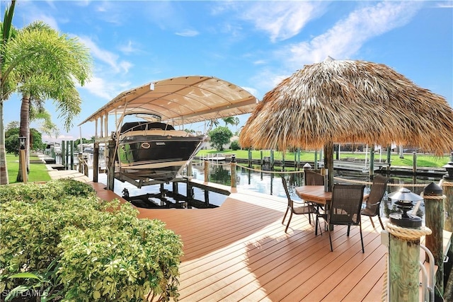 dock area with a water view and boat lift