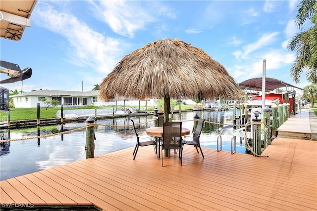 dock area with a water view and boat lift