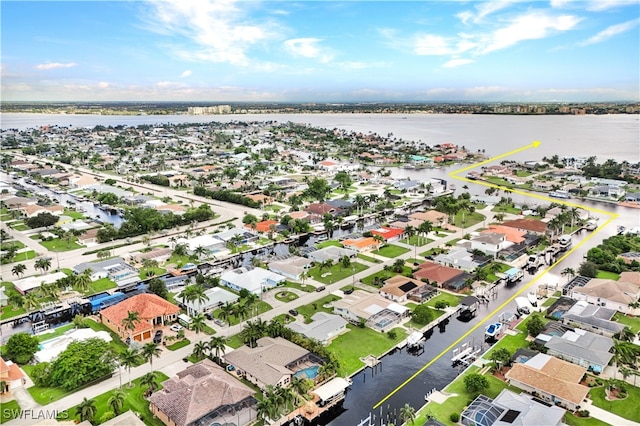 aerial view with a residential view and a water view