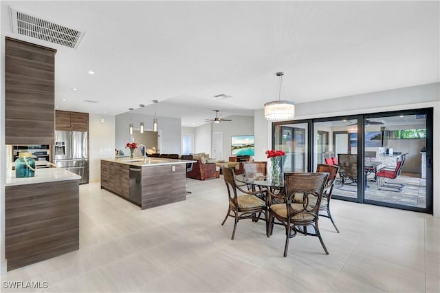 dining room featuring recessed lighting, visible vents, and ceiling fan with notable chandelier