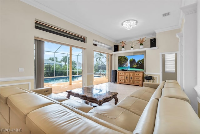 living room with light tile patterned flooring and crown molding