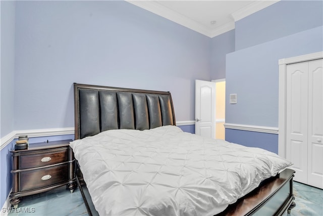 bedroom featuring ornamental molding and a closet