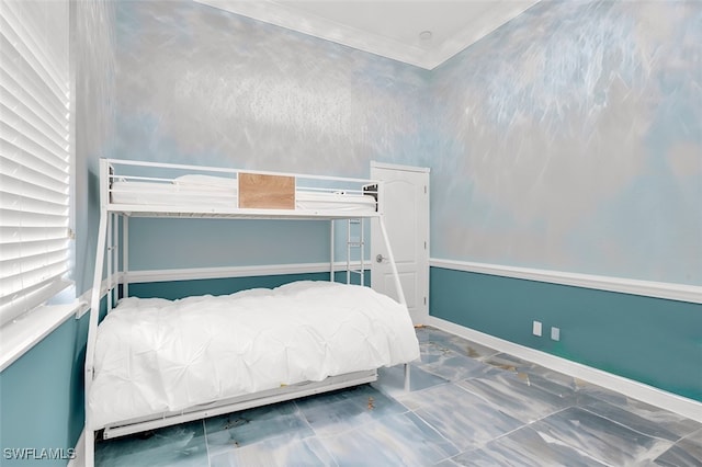 bedroom with ornamental molding