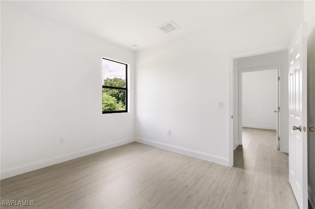 unfurnished room featuring light hardwood / wood-style flooring