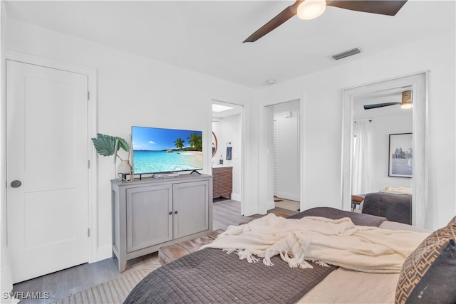 bedroom with light hardwood / wood-style flooring and ceiling fan