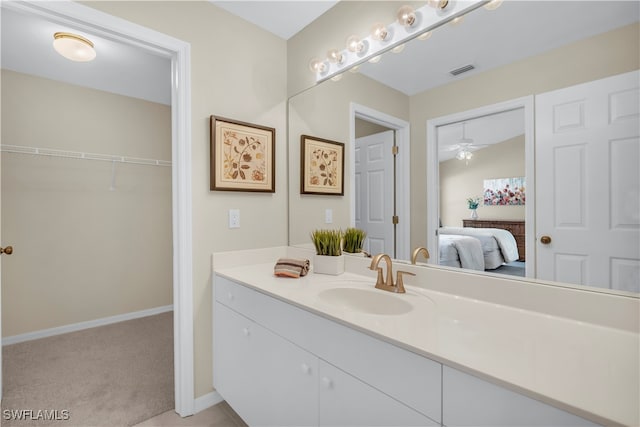 bathroom featuring ceiling fan and vanity