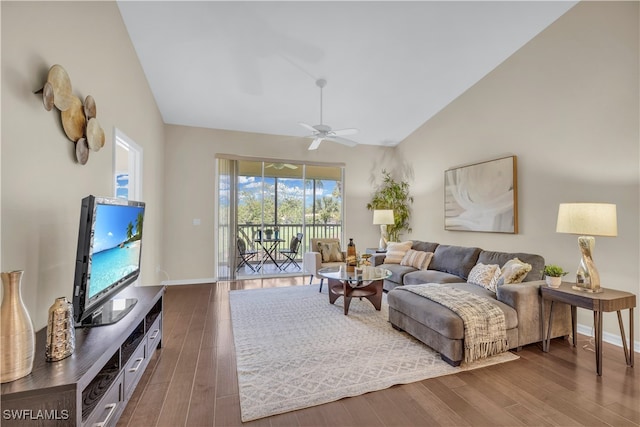 living room with high vaulted ceiling, dark wood-type flooring, and ceiling fan