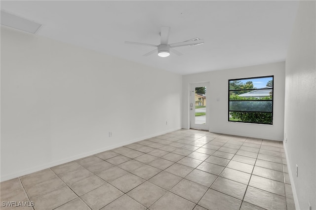 unfurnished room featuring light tile patterned floors and ceiling fan