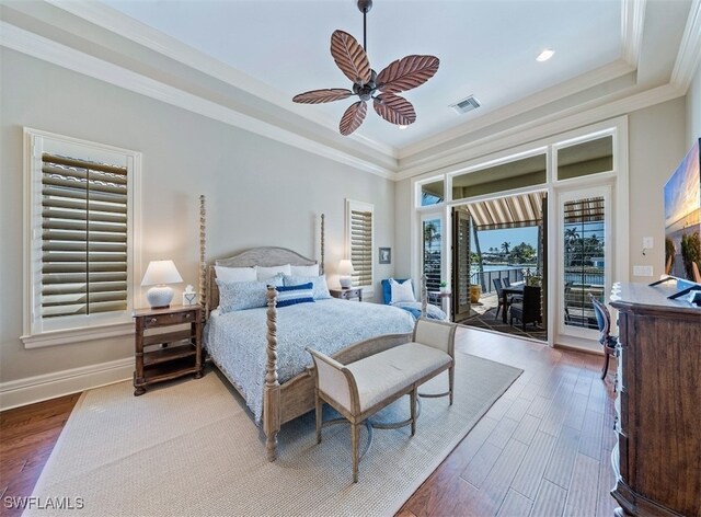 bedroom featuring access to exterior, hardwood / wood-style flooring, ceiling fan, and ornamental molding