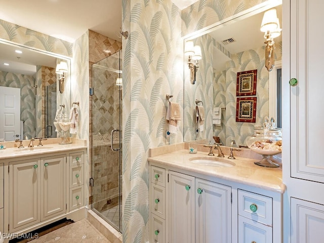 4201 Gulf Shore Blvd N Unit 402, Naples, FL 34103 - full bath featuring wallpapered walls, a stall shower, two vanities, and tile patterned floors