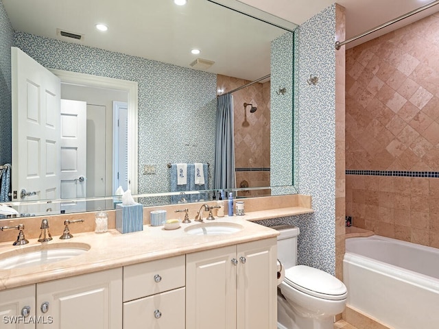 4201 Gulf Shore Blvd N Unit 402, Naples, FL 34103 - bathroom featuring toilet, double vanity, shower / bath combo with shower curtain, and recessed lighting
