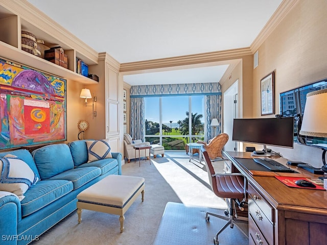 carpeted home office featuring crown molding