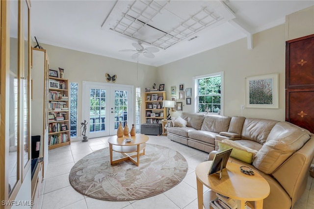 living room featuring french doors, ceiling fan, and light tile patterned floors