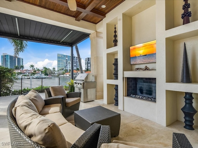 living room with beamed ceiling, built in shelves, wood ceiling, and exterior fireplace