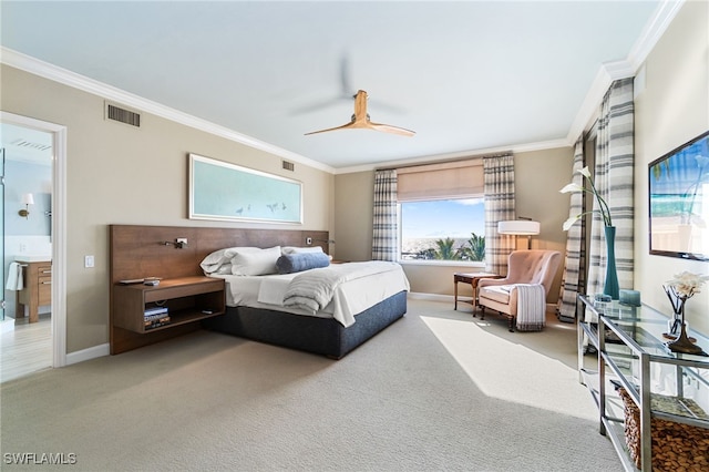 bedroom featuring carpet flooring, connected bathroom, ceiling fan, and crown molding