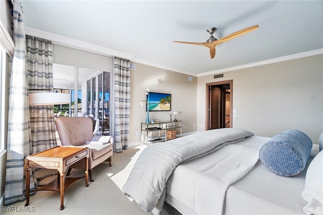 carpeted bedroom featuring ceiling fan and ornamental molding