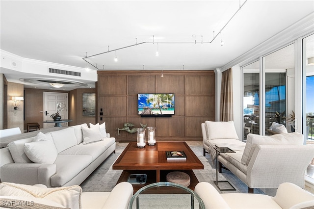 living room with ornamental molding