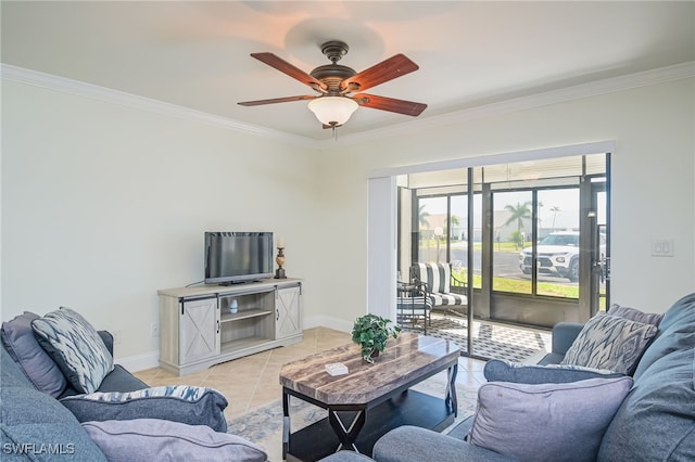 tiled living room with ceiling fan and crown molding