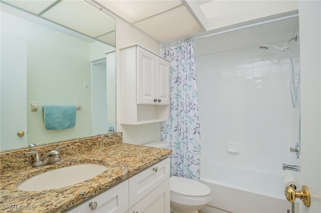 full bathroom with shower / bath combination with curtain, vanity, and toilet