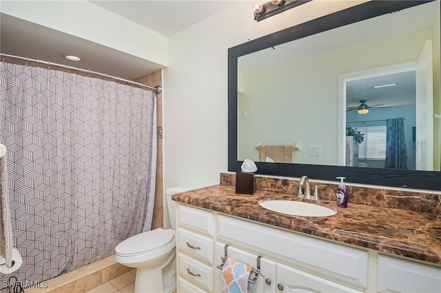 bathroom with walk in shower, tile patterned floors, ceiling fan, vanity, and toilet