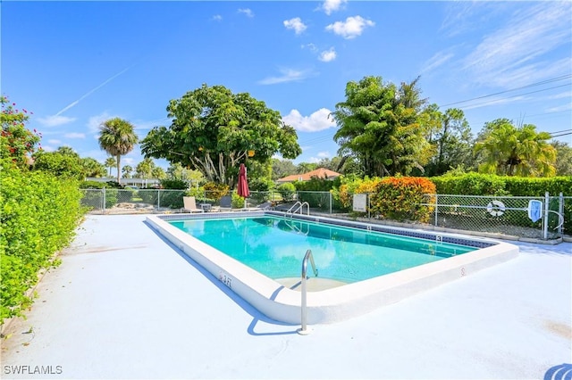 221 Cypress Way E Unit 201, Naples, FL 34110 - community pool with fence and a patio
