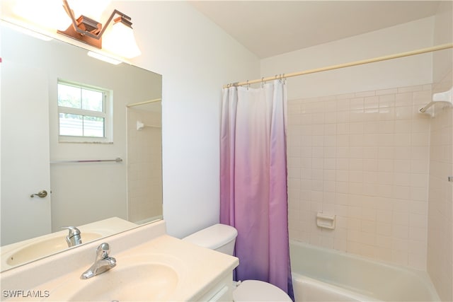 full bathroom with vanity, toilet, and shower / tub combo with curtain