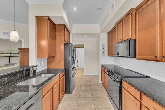 kitchen with hanging light fixtures, tasteful backsplash, stainless steel appliances, dark stone counters, and crown molding