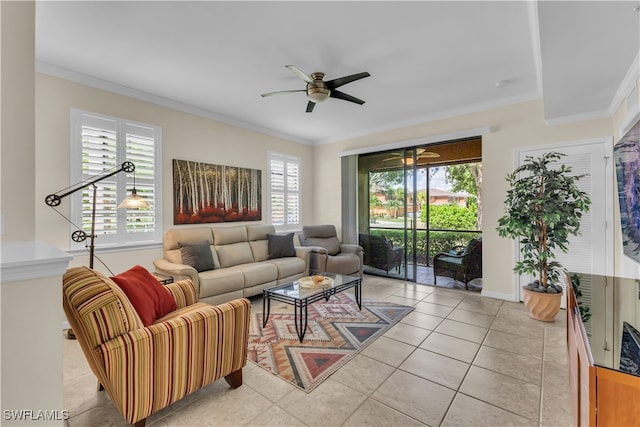 living room with ceiling fan, crown molding, and a healthy amount of sunlight