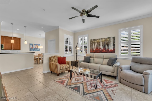 tiled living room featuring ornamental molding and ceiling fan