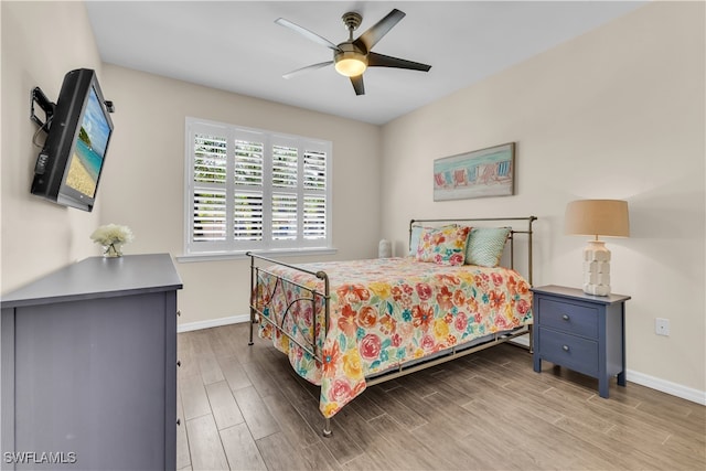 bedroom featuring light hardwood / wood-style flooring and ceiling fan