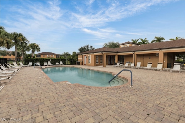 view of swimming pool with a patio