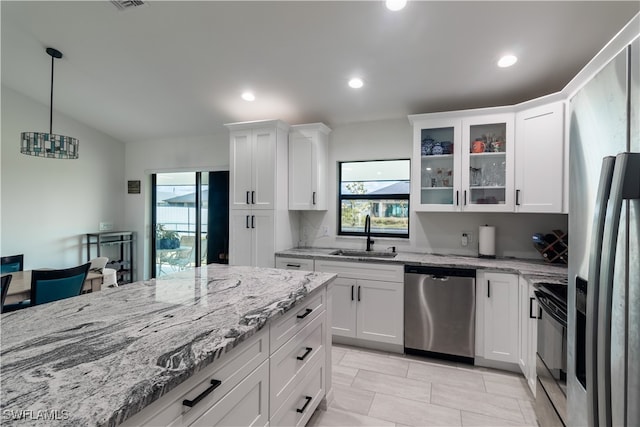 kitchen featuring white cabinetry, sink, electric range, refrigerator with ice dispenser, and stainless steel dishwasher