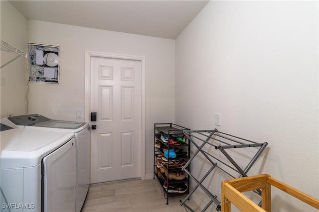 clothes washing area featuring washing machine and dryer